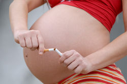 pregnantwomanbreakingciggarette